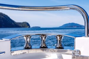 Stainless steel boat cleats and rail with scenic ocean and islands background