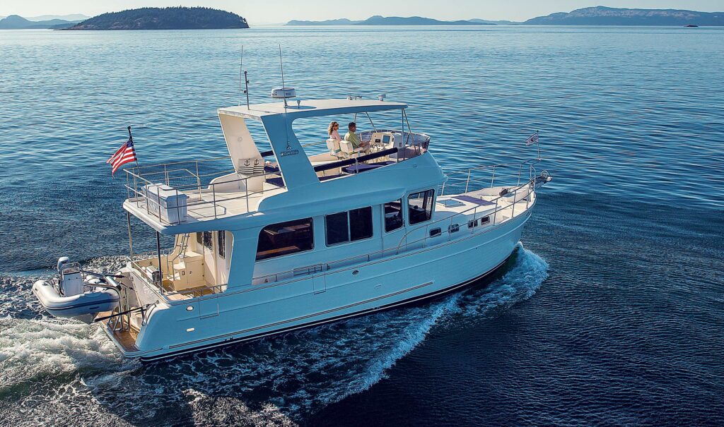 North Pacific Yachts motor yacht cruising near islands on calm sea in clear weather