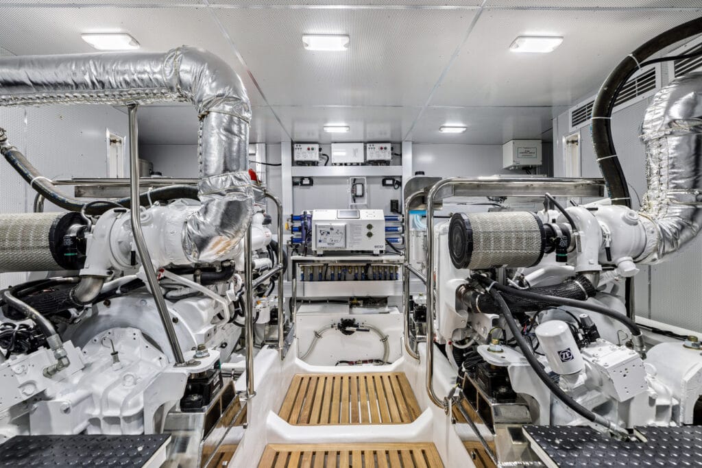North Pacific 590 engine room with engines and central access walkway
