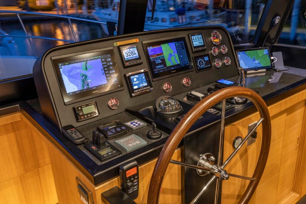 North Pacific Yacht pilothouse helm with advanced navigation and control instruments